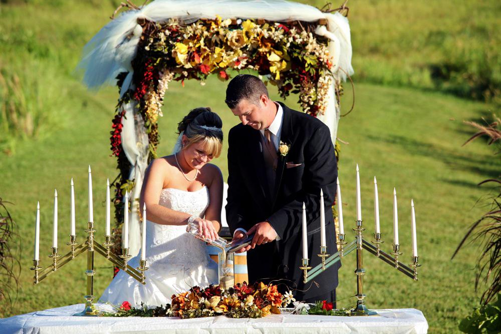 A bride and groom cutting their wedding cake.